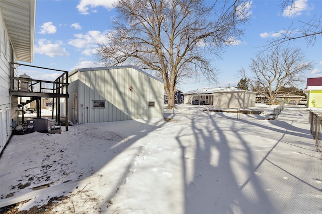 exterior space with an outdoor structure and a storage shed