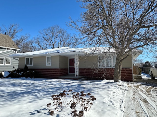 view of front of house with brick siding