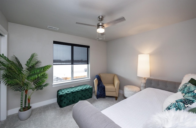 bedroom featuring baseboards, a ceiling fan, visible vents, and light colored carpet