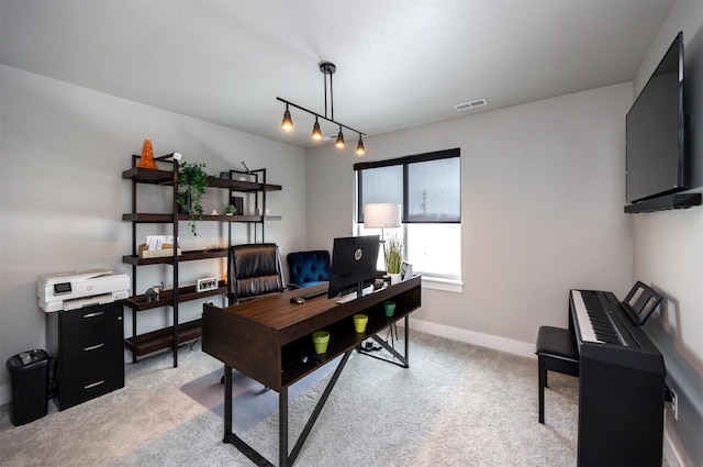 office area with light carpet, visible vents, and baseboards