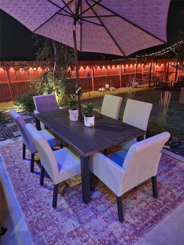 view of patio / terrace featuring outdoor dining space and a fenced backyard