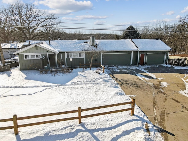 view of front of home with board and batten siding and fence