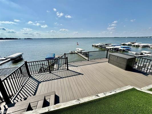 wooden terrace featuring a water view