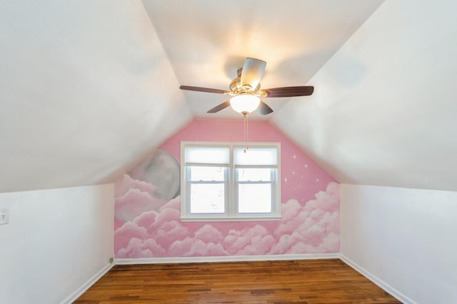 bonus room featuring vaulted ceiling, wood finished floors, and baseboards