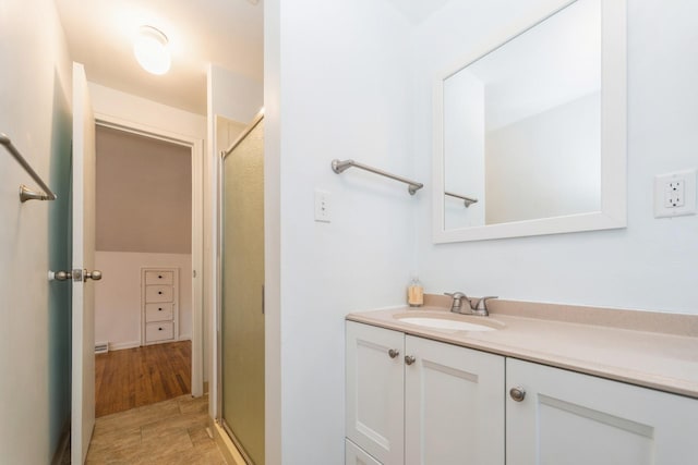 full bath featuring a shower stall and vanity