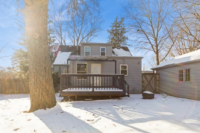 view of front facade featuring fence and a deck