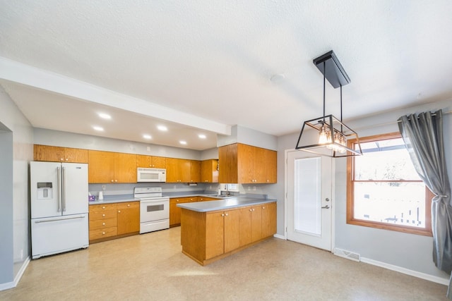 kitchen with white appliances, brown cabinetry, decorative light fixtures, a peninsula, and light floors