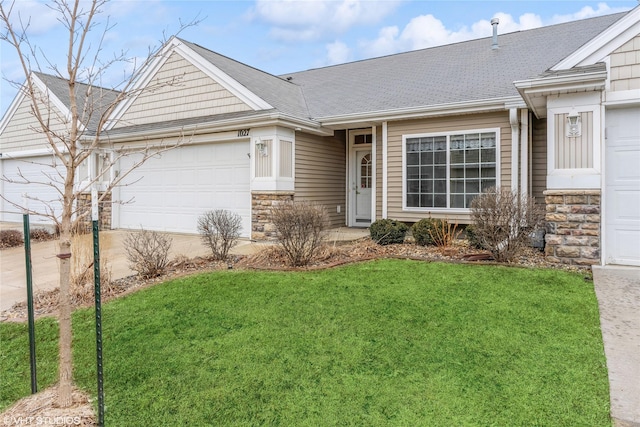 single story home featuring a front yard, stone siding, and an attached garage