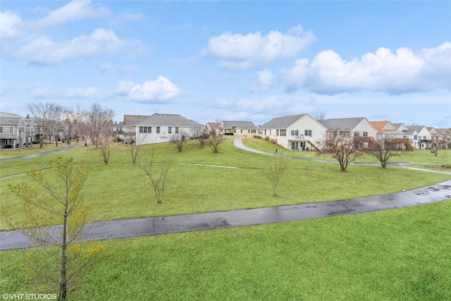 exterior space featuring a residential view and a lawn