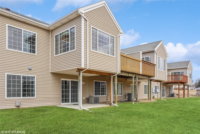 back of house with a yard, central AC, and a patio area