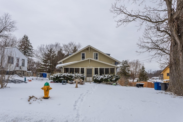 view of front of property with a sunroom