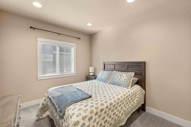 bedroom featuring recessed lighting, light carpet, and baseboards