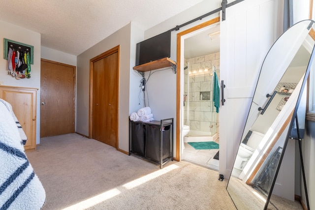 full bath featuring toilet, a stall shower, and a textured ceiling