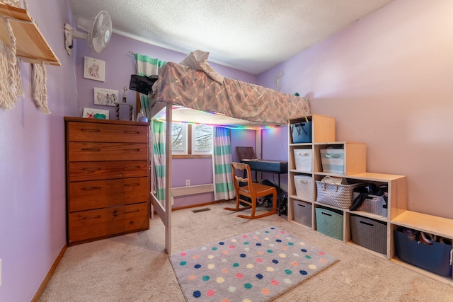 bedroom featuring baseboards, visible vents, a textured ceiling, and light colored carpet