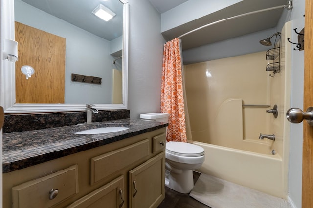 full bath with shower / bath combo, vanity, and toilet