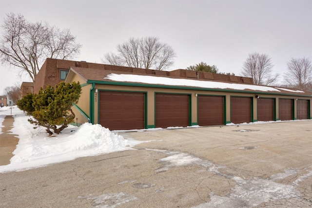 view of snow covered garage