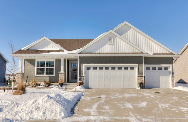 craftsman house with a garage, a shingled roof, concrete driveway, stone siding, and board and batten siding