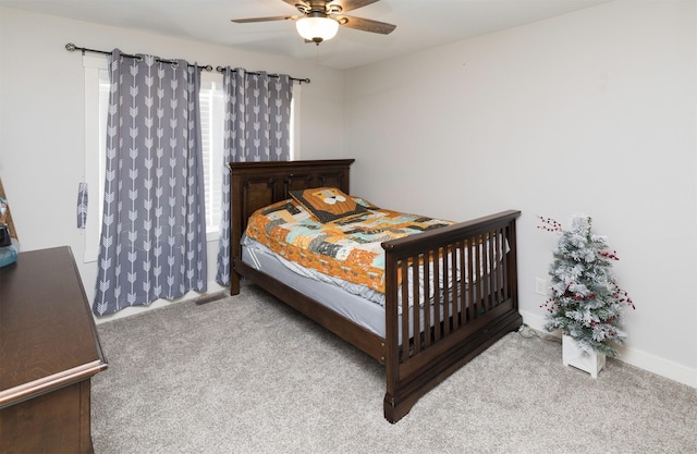 bedroom with light carpet and ceiling fan