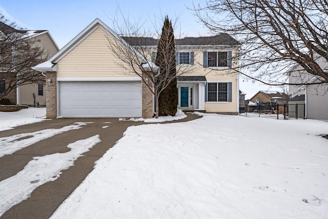 view of front of house featuring entry steps, brick siding, fence, and an attached garage