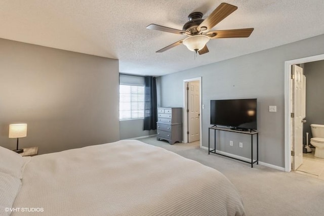 bedroom with baseboards, a ceiling fan, light colored carpet, and a textured ceiling