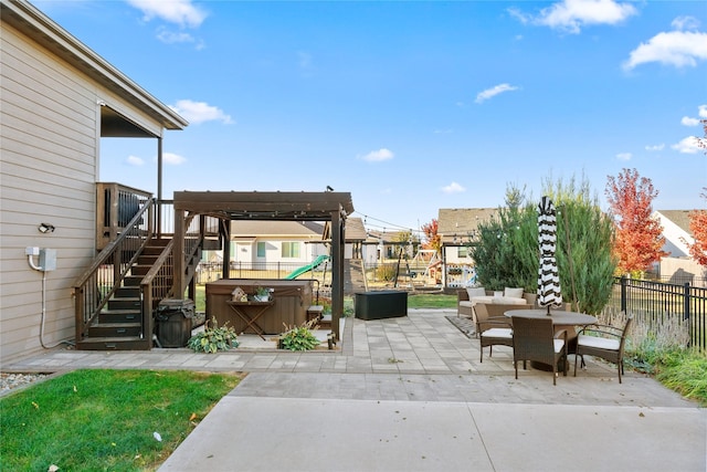 view of patio / terrace with fence, stairs, a pergola, outdoor dining space, and a hot tub