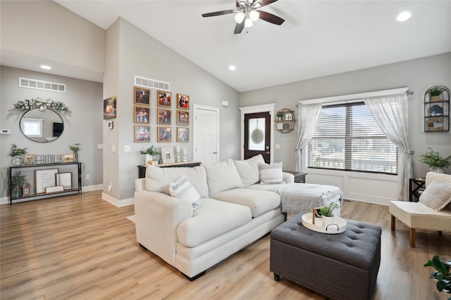 living area featuring light wood-style flooring, visible vents, and recessed lighting