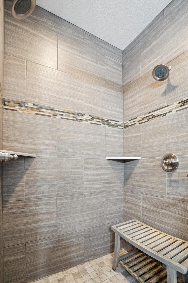 bathroom with tiled shower