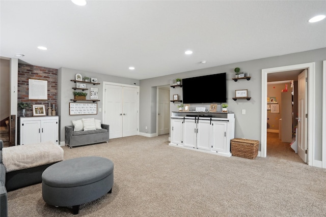 living room featuring light carpet, baseboards, and recessed lighting