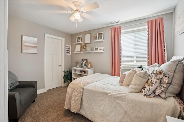 bedroom with ceiling fan, carpet, visible vents, and baseboards