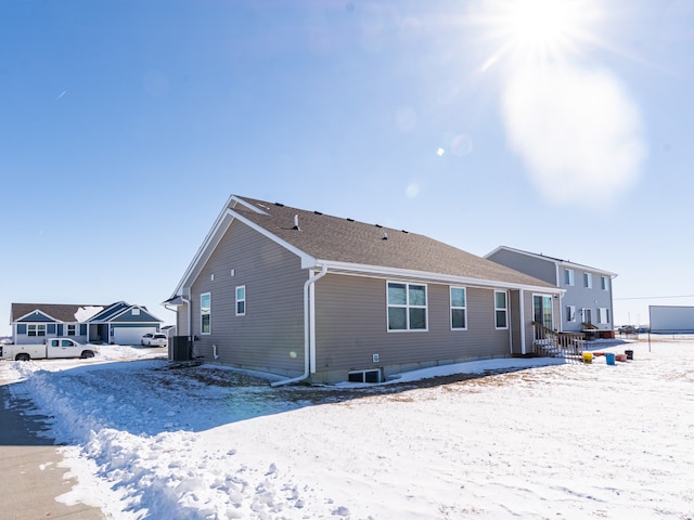 view of snow covered house