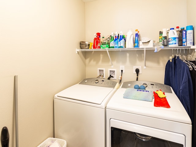 washroom featuring independent washer and dryer and laundry area