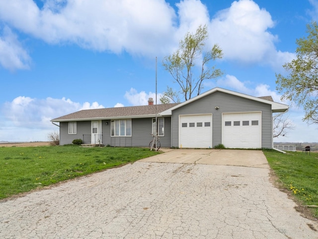 3473 Juniper Ave, Casey, IA 50048 - ranch-style house with an attached garage, a front lawn, and driveway