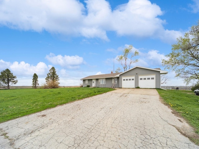 3473 Juniper Ave, Casey, IA 50048 - ranch-style home with an attached garage, a front lawn, and aphalt driveway