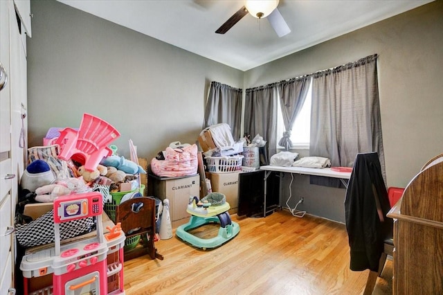 bedroom with wood finished floors and a ceiling fan