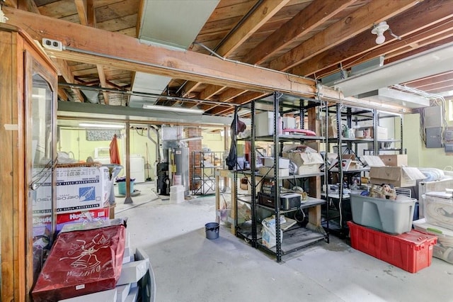 interior space with water heater and washing machine and clothes dryer