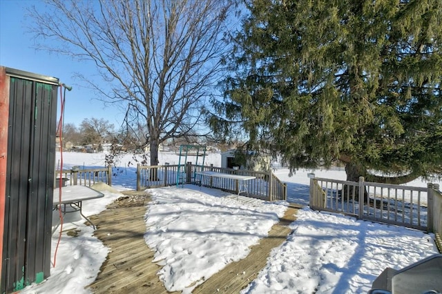 view of snow covered deck