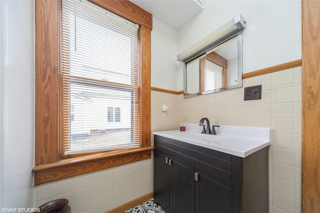 bathroom featuring tile walls and vanity