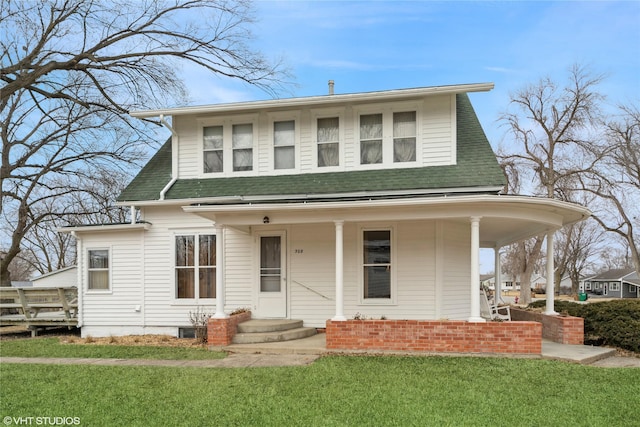 view of front of property with a porch, roof with shingles, and a front yard