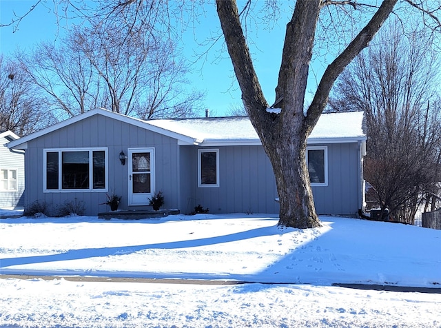 ranch-style house with board and batten siding