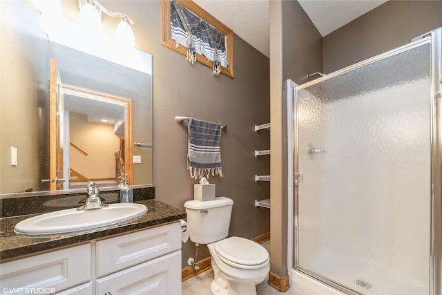 full bath with tile patterned flooring, toilet, vanity, baseboards, and a shower stall