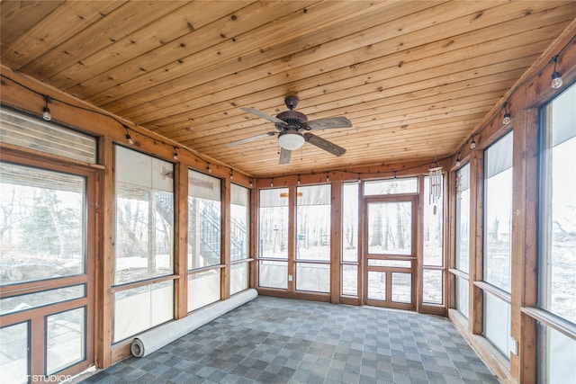 unfurnished sunroom featuring ceiling fan and wooden ceiling