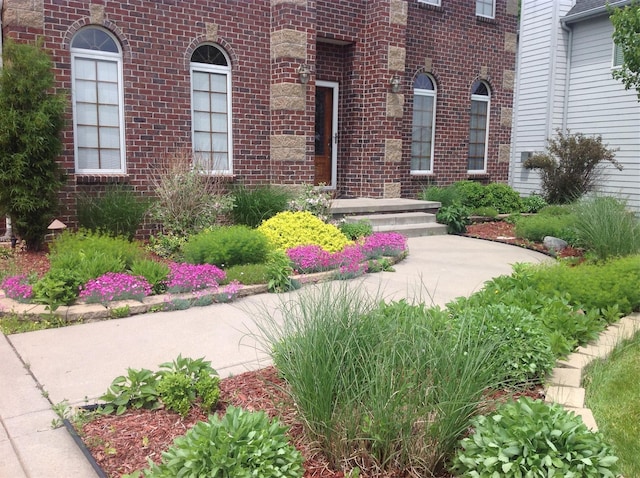 property entrance with brick siding