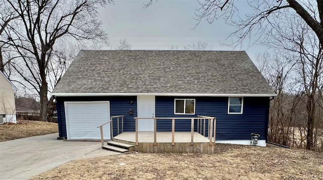 view of front facade with roof with shingles