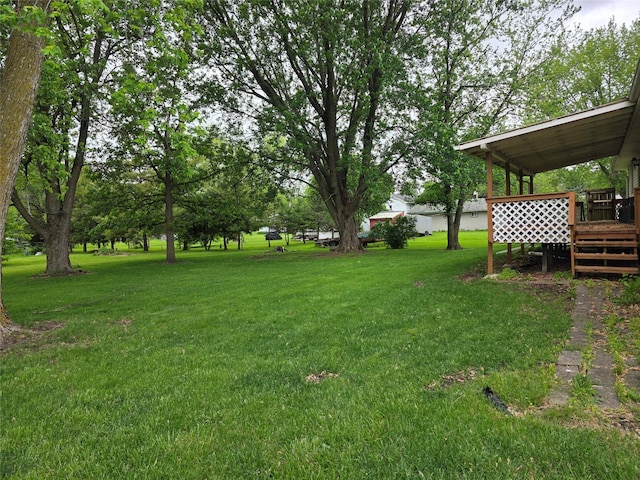 4655 NE 41st Ave, Des Moines, IA 50317 - view of green lawn featuring a wooden deck