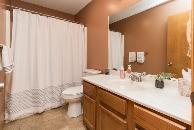 full bathroom featuring toilet and vanity