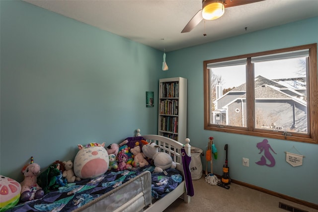 bedroom featuring ceiling fan, carpet, visible vents, and baseboards