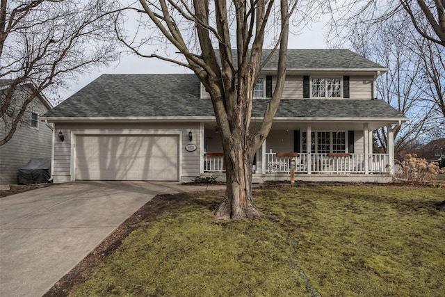 traditional-style home featuring roof with shingles, a porch, a front yard, a garage, and driveway