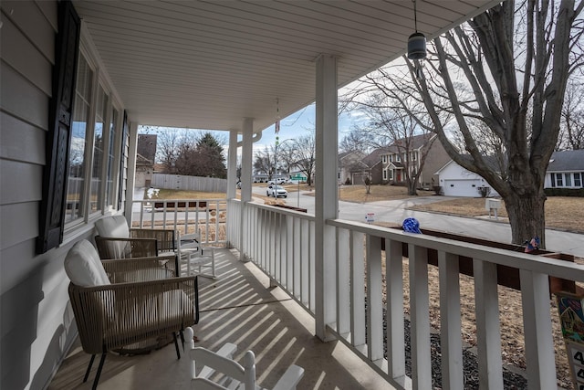 balcony featuring a porch and a residential view