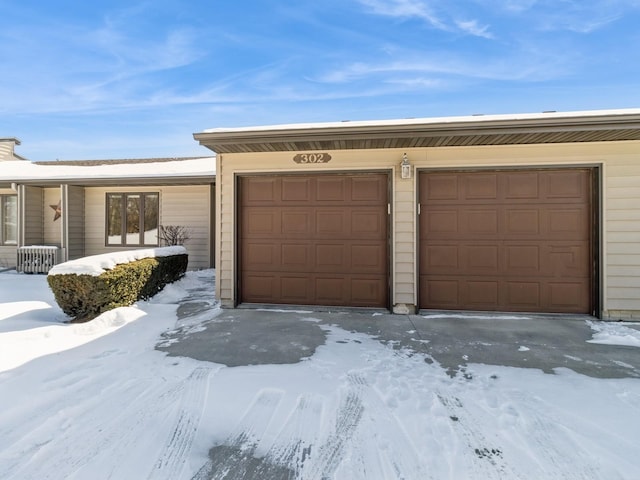 view of snow covered garage