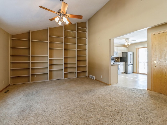 spare room with light carpet, baseboards, visible vents, and a ceiling fan